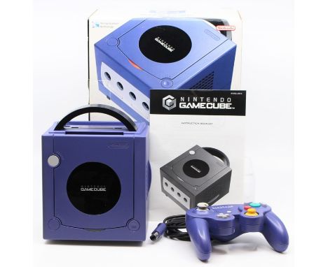 Nintendo GameCube: A boxed Nintendo GameCube purple console, appears complete with instructions and one controller; together 