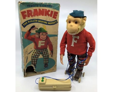 Alps: An Alps, Japan, battery operated, Frankie the Roller Skating Monkey, working, original damaged box. together with a bat