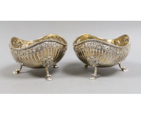 A pair of late Victorian fluted silver sweetmeat bowls, on tripod supports, Daniel &amp; John Welby, London, 1885, diameter 1