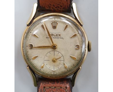 A gentleman's mid 1950's 9ct gold Rolex shock-resisting manual wind wrist watch, with baton and Arabic numerals and subsidiar