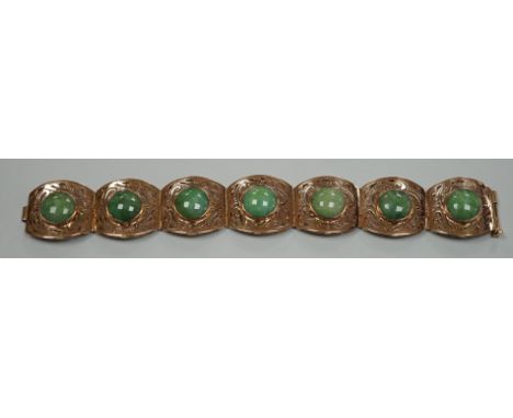 A continental 18k yellow metal and seven stone cabochon jade set bracelet, with pierced links, 18.5cm, gross weight 39.3 gram