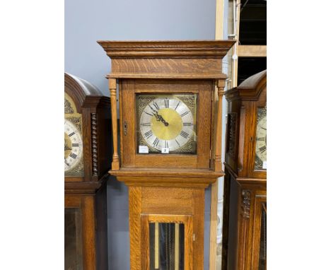 An oak longcase clock, with a square brass and silvered dial, height 203cm