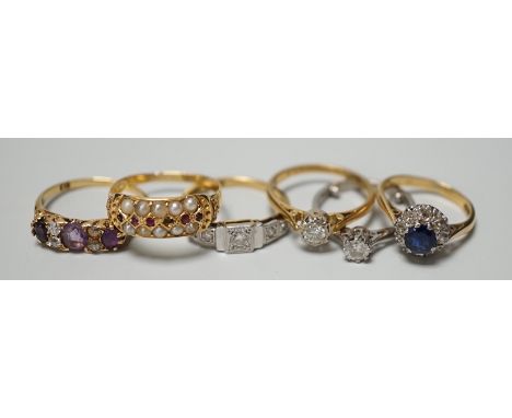 Five assorted 18ct and gem set rings, including 1920's millegrain diamond set, two solitaire diamond rings, sapphire and diam