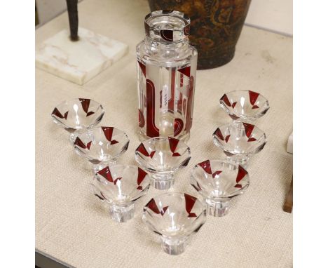 An Art Deco Bohemian ruby flashed decanter and 8 glasses, decanter 22cms high