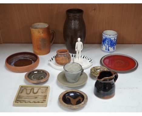 A group of studio pottery including St. Ives Leach pottery jug two dishes and a saucer
