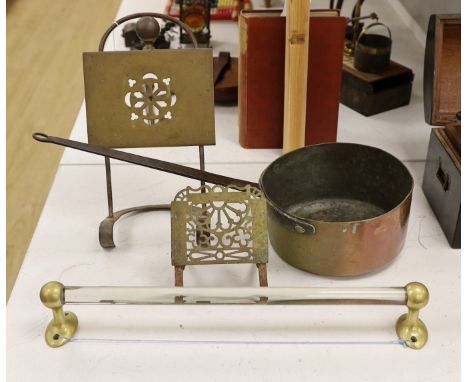 Two brass grate trivets, a crystal and brass towel rail and a 19th century copper pot