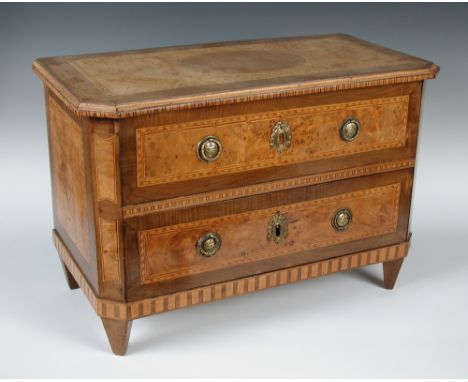 A 19th century Milanese miniature walnut marquetry commode, the rectangular top with canted front corners and inlaid oval car