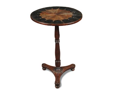 A late Regency coromandel wood pedestal occasional table, with radiating specimen wood inlaid circular top, on a triform base