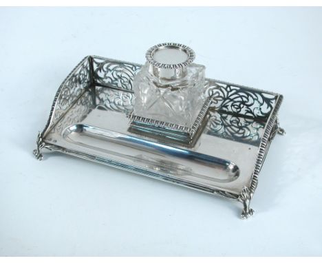 A late Victorian silver ink stand, by Charles Stuart Harris, London 1892, with pierced gadroon edged gallery and raised on fo