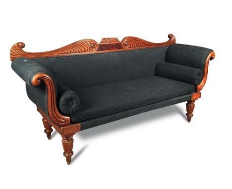 A late Regency mahogany sofa, scroll and gadroon carved show wood, upholstered in a black fabric with scrolling arms and on g