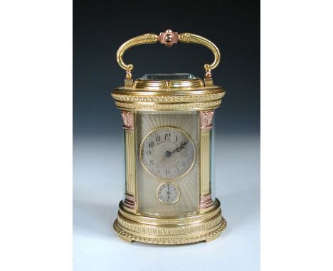 A French cylinder shaped gilt brass repeating carriage clock, circa 1900, the circular silvered dial marked 'Bigelow, Kennard