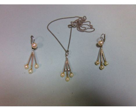 An Italian 18ct white gold and pearl earring and necklace suite, the earrings with hook and snap fittings fronted by a 6.5mm 