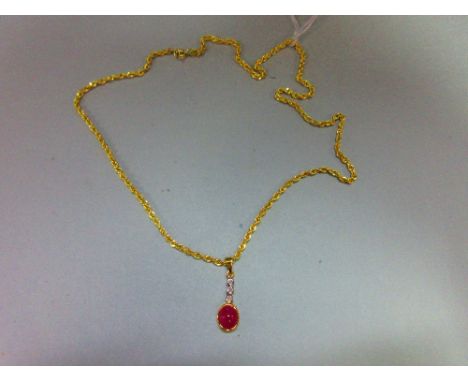 A ruby and diamond pendant with gold chain, the pendant designed as an articulated line of collet set stones, three small rou