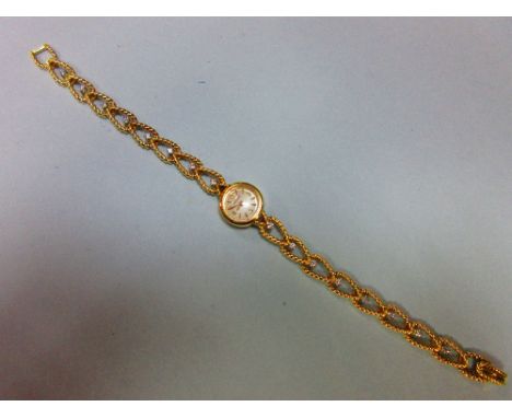 A Jaeger-LeCoultre lady's 18ct gold wristwatch with diamond set bracelet, the small circular cream coloured dial with arabic 