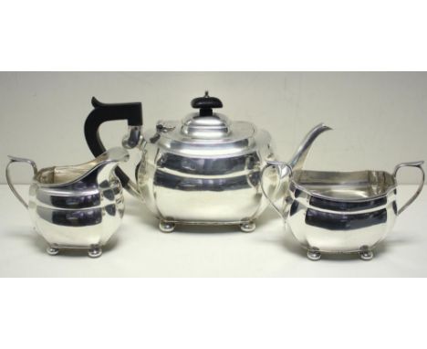 An Edwardian three piece silver teaset, by S Blackensee & Sons, Birmingham and Chester 1930, comprising: A teapot of canted r