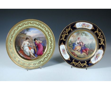 A 19th century Vienna plate painted with Diana the huntress seated on her red cloak by a bluff chosing an arrow from her quiv
