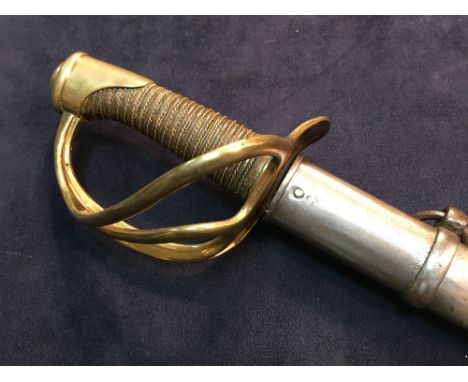 A 19th century French cavalry sword, the blade dated 1877, with brass three loop guard and wire bound grip, serial numbber 22