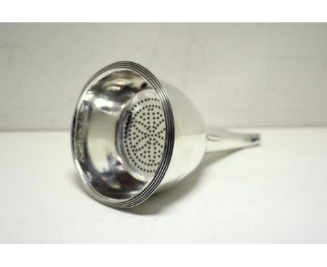A George III silver wine funnel, maker's mark indistinct, London 1809, the deep reed edged bowl above a ribbed spout, the det