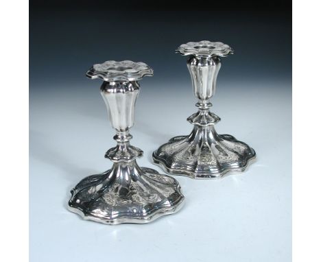 A pair of Victorian silver dwarf candlesticks, by Henry Wilkinson & Co, Sheffield 1849, the lobed circular bases foliate scro