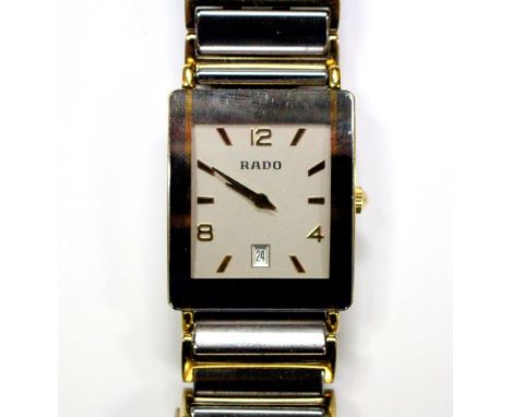 By Rado - a unisex 'Diastar' steel , titanium and gold plated quartz wristwatch, the rectangular silvered dial with Arabic an