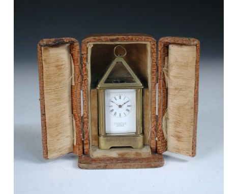 A French miniature lantern style carriage timepiece, circa 1900, with pyramid glazed top above 3cm (1in) enamel dial marked '