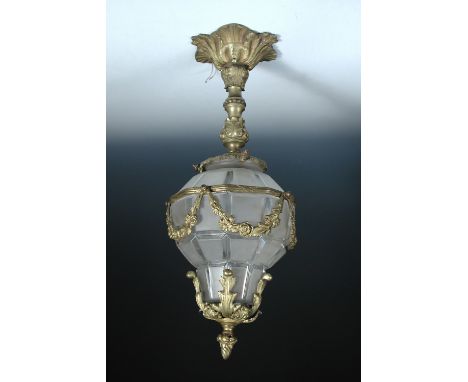 A modern brass mounted and frosted glass hall lantern, the pear shaped facetted glass shade mounted with floral sprigs and ap