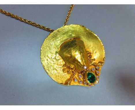 A contemporary emerald and diamond set disc pendant and 18ct gold chain, the variably textured and dribble-edged disc with ce