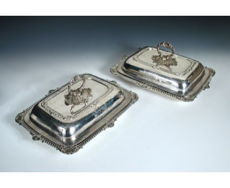 A pair of George III silver entree dishes and covers, by William Elliott, London 1818, each of rectangular shape with gadroon
