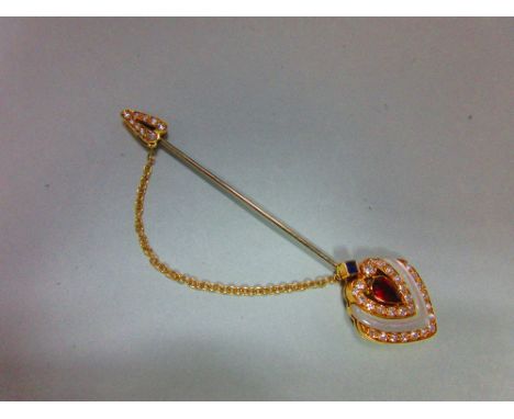 An Italian 18ct gold diamond and gem set jabot pin, the principal end heart shaped and formed by a pear cut ruby in a triple 