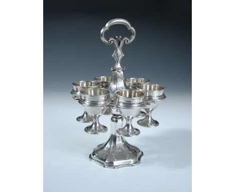 A Victorian silver egg frame, by Edward & John Barnard, London 1862, the hexagonal foot engraved with anthemion design suppor