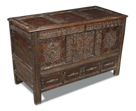 A 17th century panelled oak mule chest, carved with date 1683 and to the front panels, moulded drawer fronts, on stile legs 7