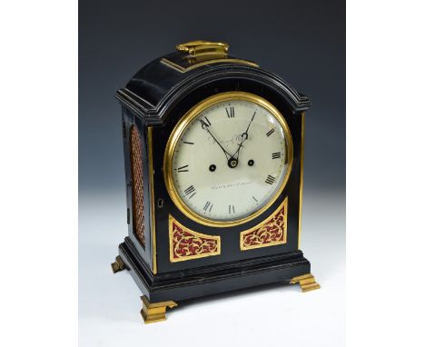 A Regency ebonised bracket clock by Desbois & Wheeler, London, the single pad top with brass handle, 17cm (6.5in) circular en