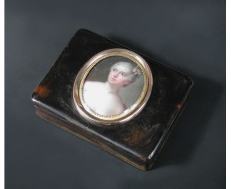 An early 19th century tortoiseshell portrait snuff box of rectangular form, the cover applied with an oval gold frame contain