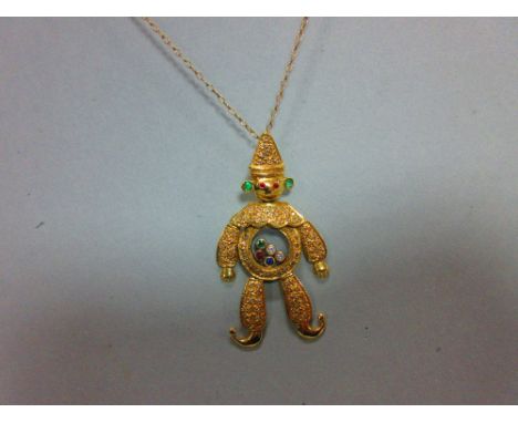 A 'happy diamond' and gem set clown pendant in the style of Chopard, the articulated figure with hat and costume pavé set wit