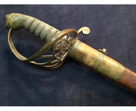 A Victorian officer's sword by Mole, with undecorated blade, pierced guard with cipher in a damaged leather two ring scabbard