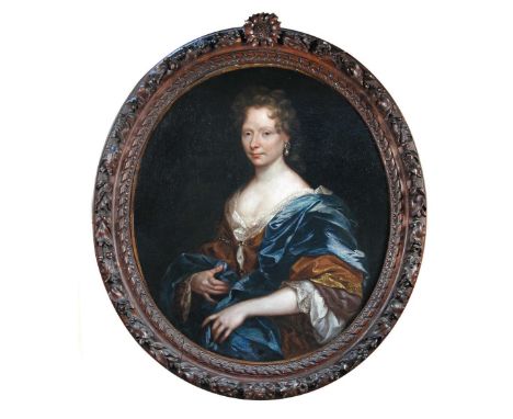 Circle of William Wissing (Dutch, 1656-1687) Portrait of a lady in a gold dress and blue cloak, with pearls in her ears, half