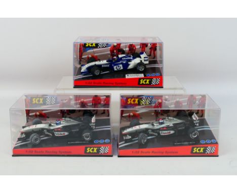 SCX - Three boxed 1:32 scale F1 slot cars. Lot consists of SCX #60880 McLaren Mercedes  MP$-16 'Mika Hakkinen' (sits loose wi