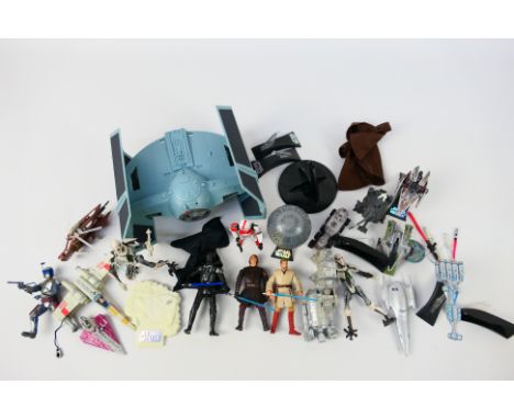 Hasbro - Other - An unboxed group of Star Wars action figures and collectable models. Lot includes a Hasbro Titanium Series d