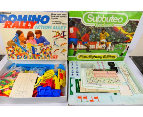 Subbuteo - Action GT - A boxed Subbuteo Table Soccer set # S130 and a boxed Domino Rally Action Alley set. They show signs of