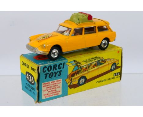 Corgi Toys - A boxed Corgi Toys #436 Citroen Safari ID19. The model in yellow/orange with driver and passenger and luggage, r