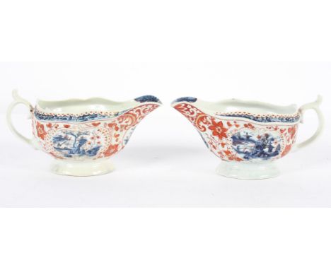 A pair of Worcester silver shaped sauce boats, circa 1770, blue painted in the Fisherman and Billboard pattern, clobbered, bl