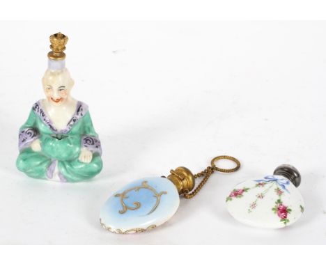 A collection of porcelain scent bottles, mainly continental and 19th century, including a pair modelled as Derby style crinol