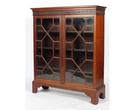 A George III style mahogany glazed display cabinet, probably early 20th century, bearing Phillips &amp; Sons, Bristol label, 