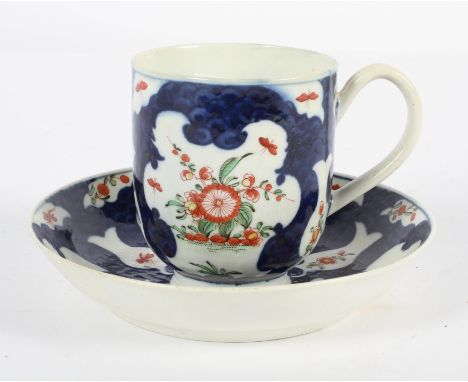 A Worcester Coffee Cup and Saucer, circa 1770, in a Japan pattern on a blue scale ground, square seal marks, saucer diameter 