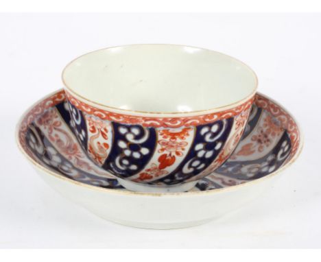 A Worcester Tea Bowl and Saucer, circa 1770, in the 'Queen Charlotte' pattern, square seal marks, saucer 13.5cm diameter