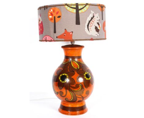 A large Bellini 1960's vintage Italian pottery lamp base, of baluster form, in a burnt orange ground with yellow autumnal flo