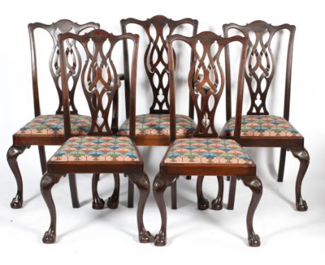 A set of five Chippendale style mahogany century chairs, late 19th century, with pierced vase shaped splats, drop in seats an