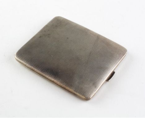 A silver cigarette case of rectangular form, engine turned decoration throughout, hallmarked Birmingham 1947 by E J Trevitt &