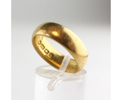 A yellow metal 6.20mm D shape wedding ring with personal inscription. Hallmarked 22ct gold, London, 1900. Size: M 10.4 grams