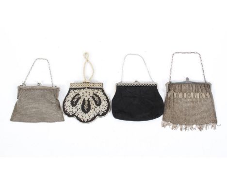 Four vintage evening bags, early to mid 20th century, comprising: two Art Deco white metal mesh link examples, a black silk a